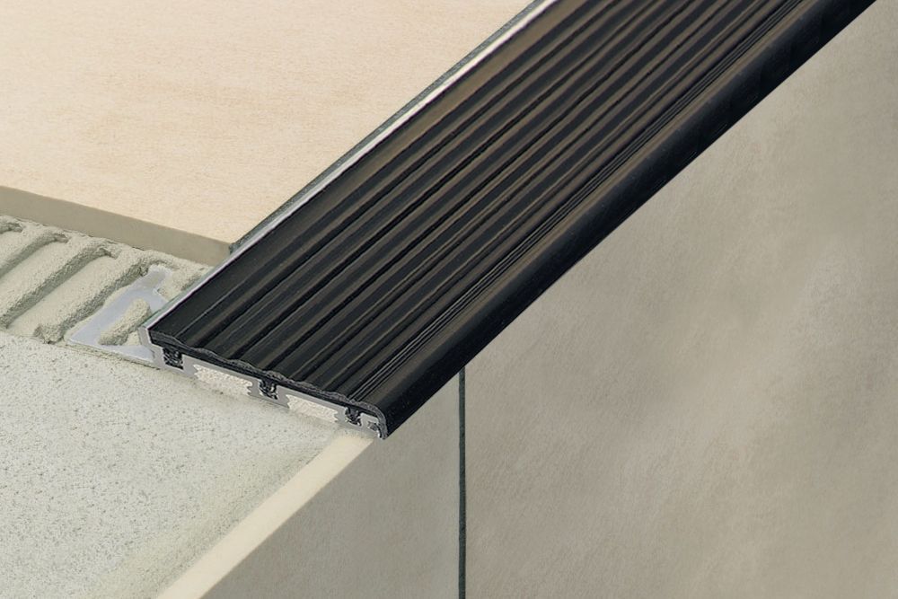 MAGMASCHLUTER SYSTEMS Schluter®-TREP-SE-S-B Stair-nosing profile with slip-resistant, thermoplastic rubber wear surface aluminum8 mm (5/16")-26 mm (1-1/32")-150 cm (4' 11")blackSCHLUTER SYSTEMS Schluter®-TREP-SE-S-B Stair-nosing profile with slip-resistant, thermoplastic rubber wear surface